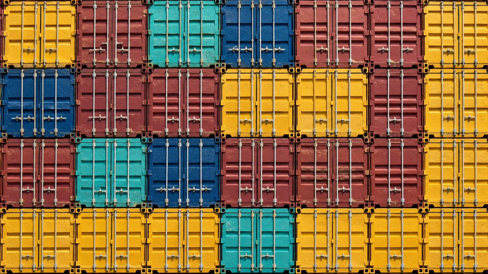 Rows of mustard, teal, navy and oxblood shipping-container doors crafted from layered paper.